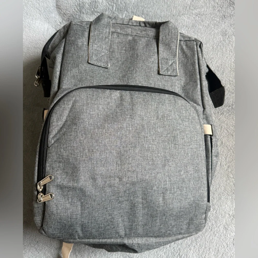 Gray Baby Backpack/Diaper Bag with fold out portable bassinet